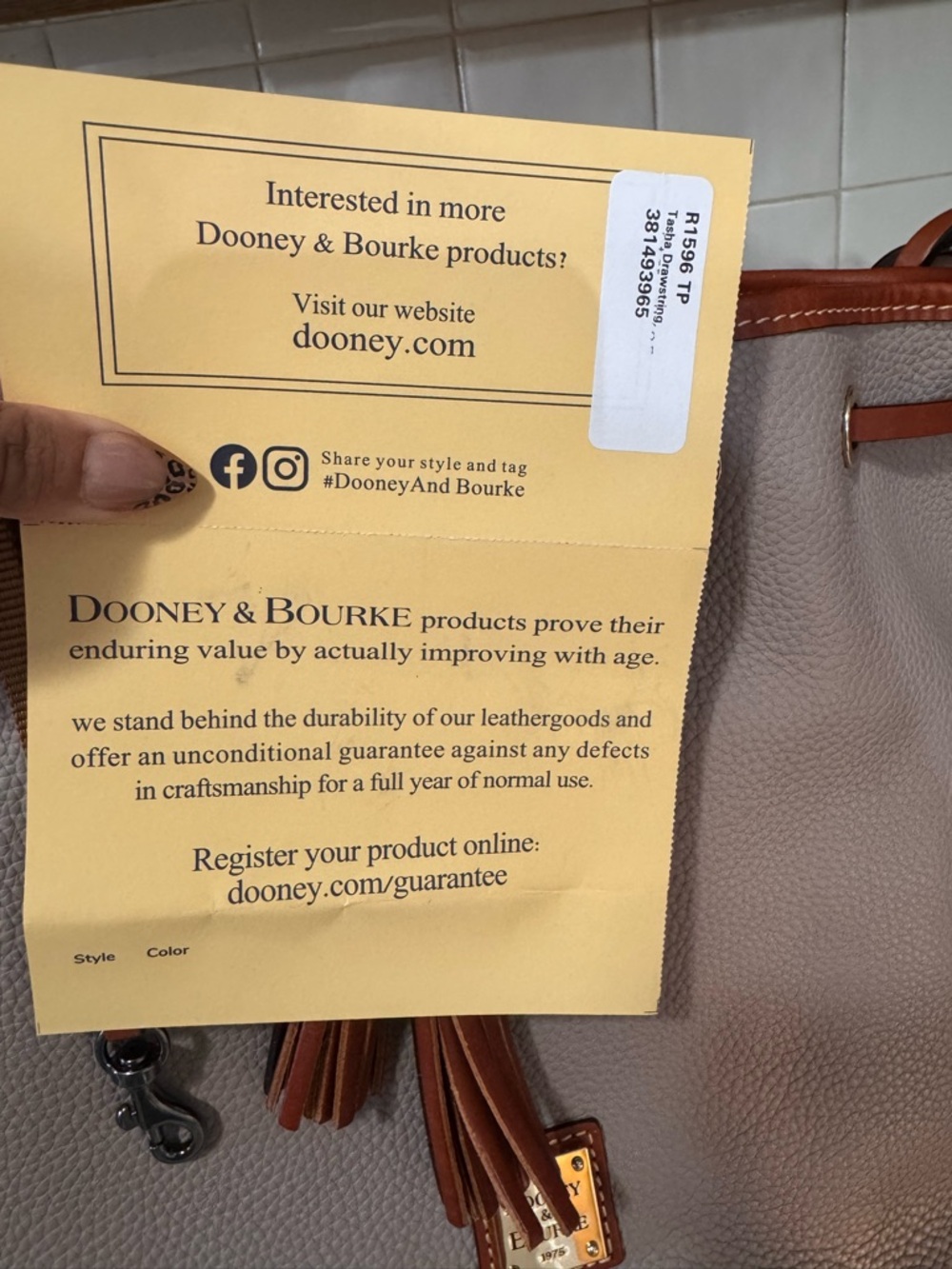 Dooney & Bourke Taupe Pebbled Leather Drawstring Bucket Bag with Brown Trim - Picture 3 of 5